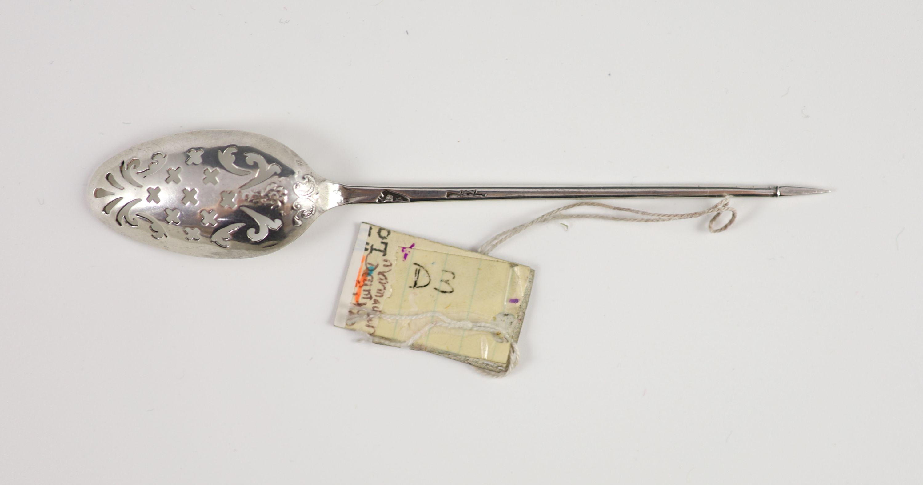 An 18th century fancy back silver mote spoon, circa 1750, 13cm long.